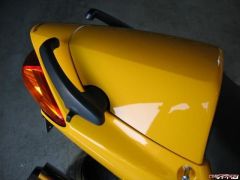 Modified seat cowl to allow grab handles to remain in place