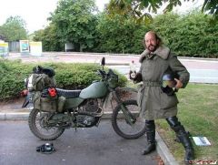 Guy and army bike.JPG