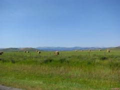 Pastures haybales and the Rockies