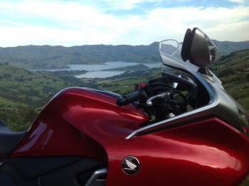 009. Akaroa township in the distance.  Great road up and down, all very smoothly sealed 35 to 65 kph corners. Nice!